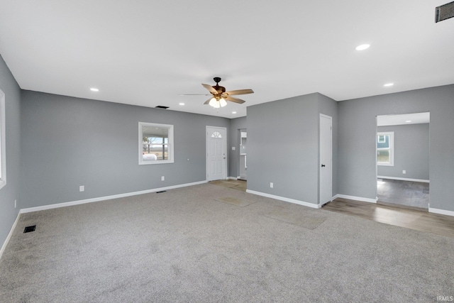 carpeted empty room with ceiling fan