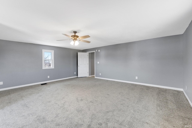 carpeted empty room with ceiling fan