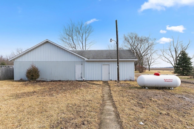 view of outbuilding with a yard