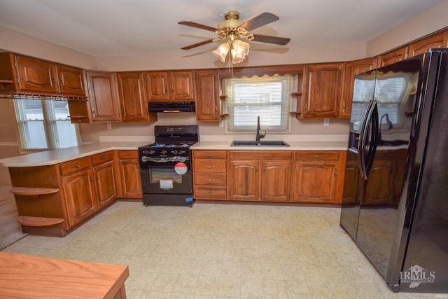 kitchen featuring sink, black appliances, and ceiling fan