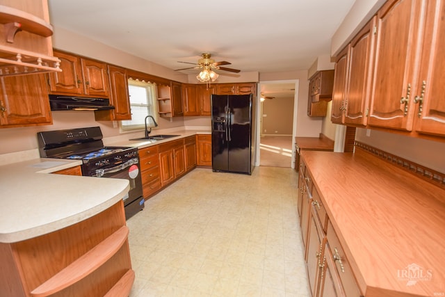 kitchen featuring ceiling fan, butcher block countertops, sink, and black appliances