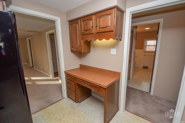 home office with light colored carpet