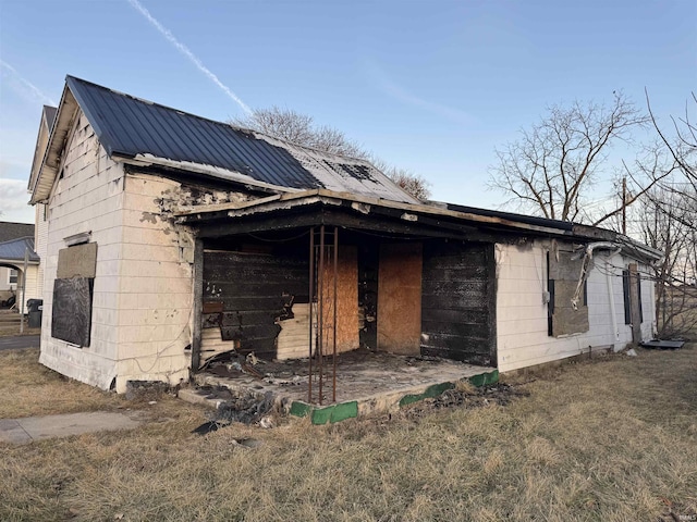 view of property exterior featuring an outbuilding