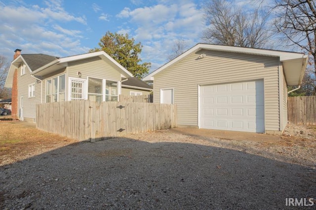 view of side of home featuring a garage