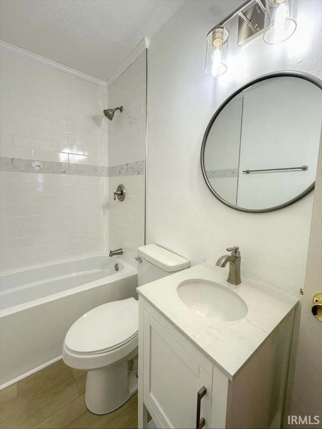 full bathroom with tiled shower / bath combo, vanity, ornamental molding, a textured ceiling, and toilet