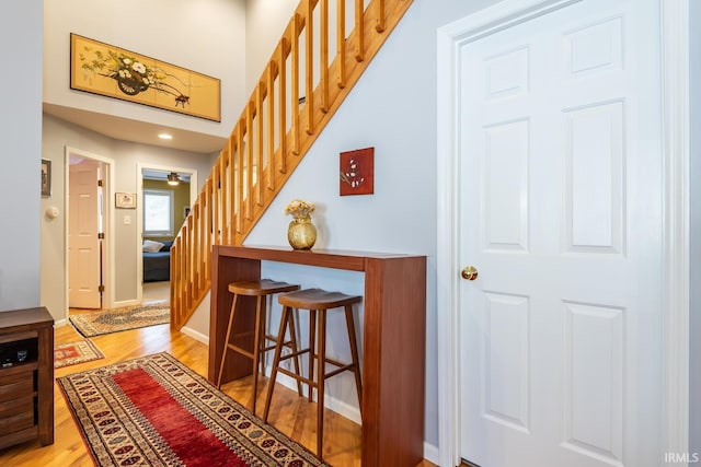 staircase featuring hardwood / wood-style flooring