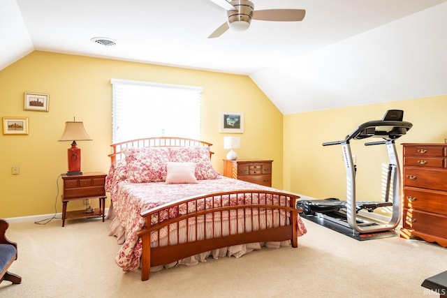 carpeted bedroom with vaulted ceiling and ceiling fan