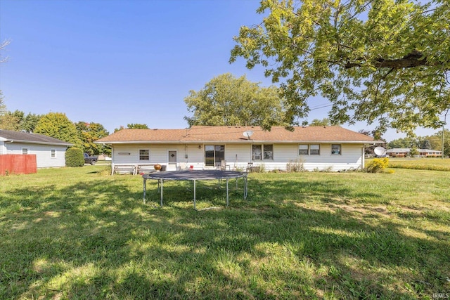 rear view of house with a lawn