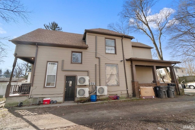 view of front facade featuring a porch and ac unit