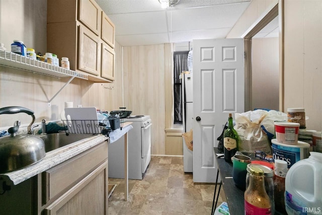 laundry area featuring cabinets and washing machine and dryer