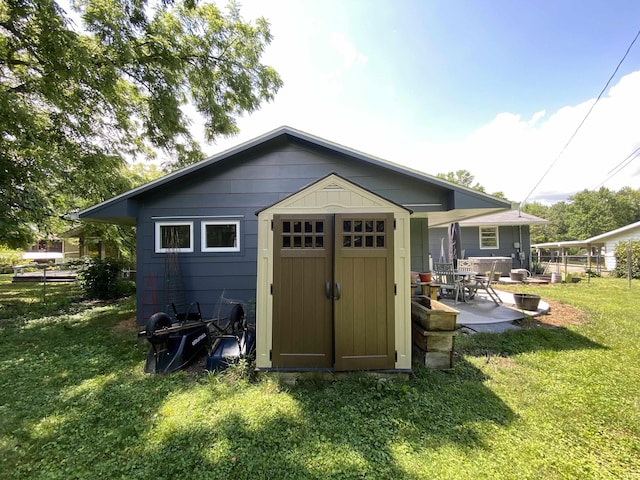 view of outdoor structure with a yard