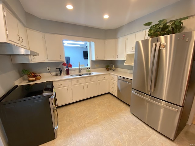 kitchen featuring appliances with stainless steel finishes, sink, and white cabinets