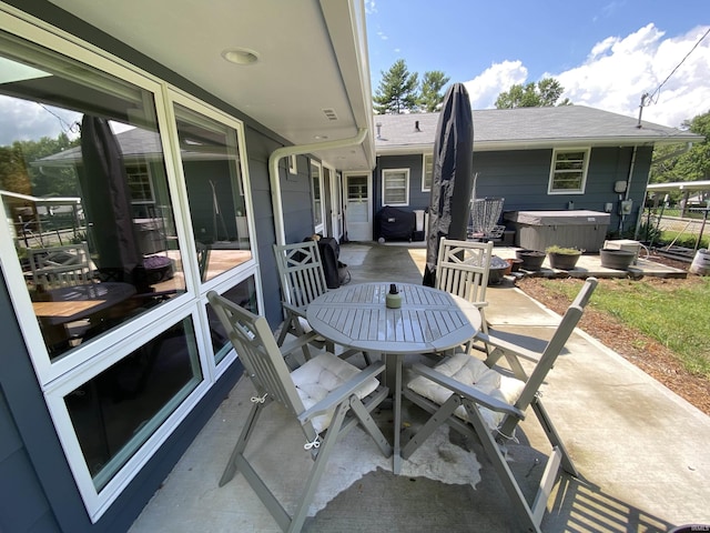 view of patio / terrace featuring a hot tub