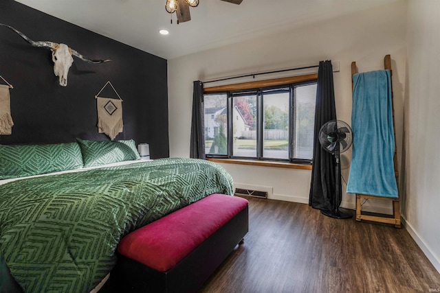 bedroom with ceiling fan and dark hardwood / wood-style flooring