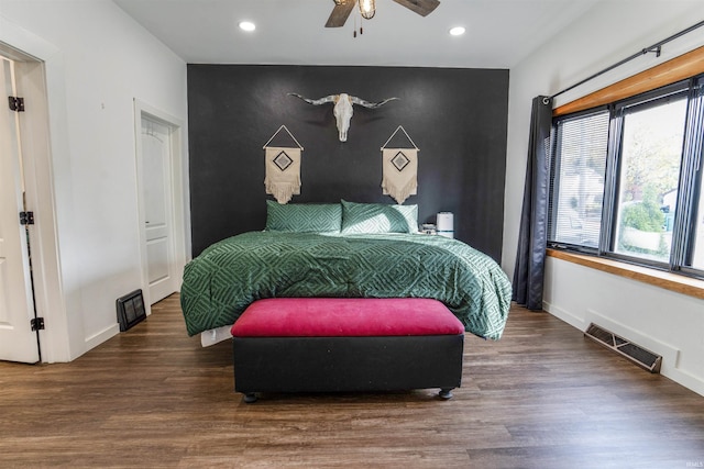 bedroom featuring dark hardwood / wood-style flooring and ceiling fan