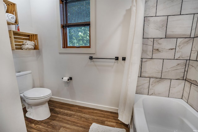 bathroom with toilet and hardwood / wood-style floors