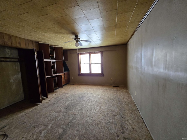 unfurnished room with ceiling fan