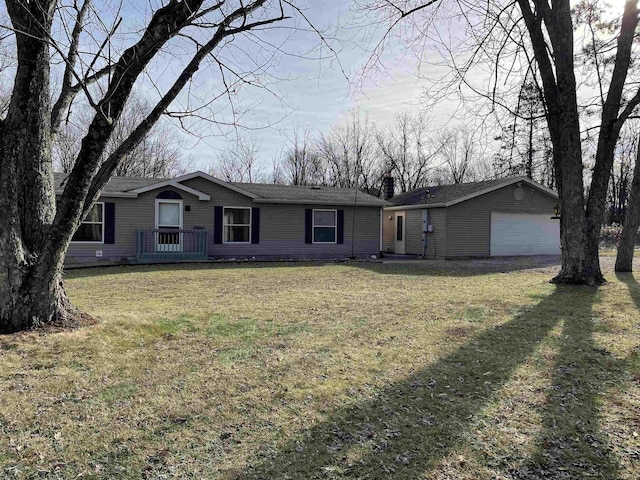 single story home with a garage and a front yard