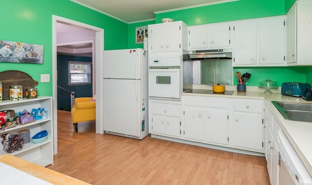 kitchen featuring white cabinets, white appliances, and light hardwood / wood-style floors