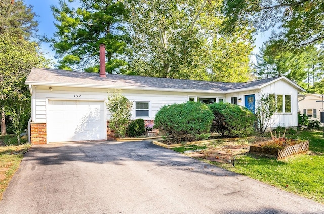 ranch-style home featuring a garage