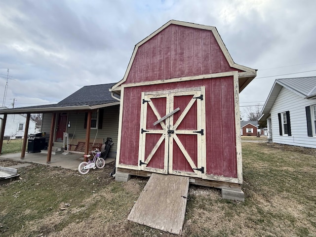 view of outdoor structure with a lawn