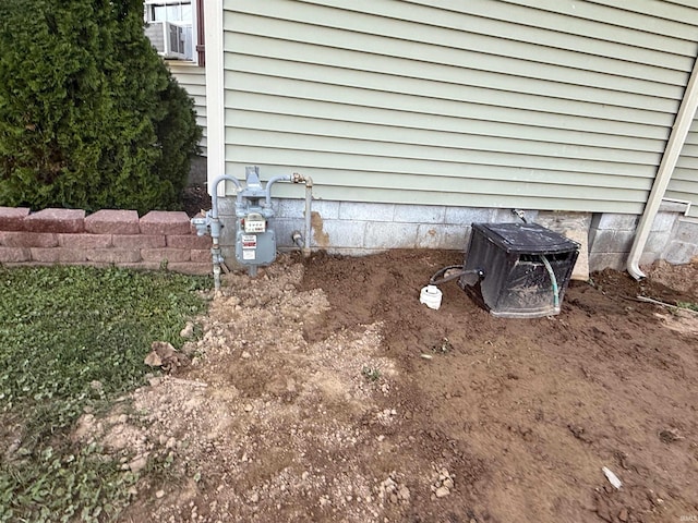 1705 E Main St, Petersburg, IN 47567 - exterior view of a wood stove and gas meter