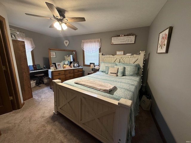 bedroom featuring ceiling fan and carpet flooring