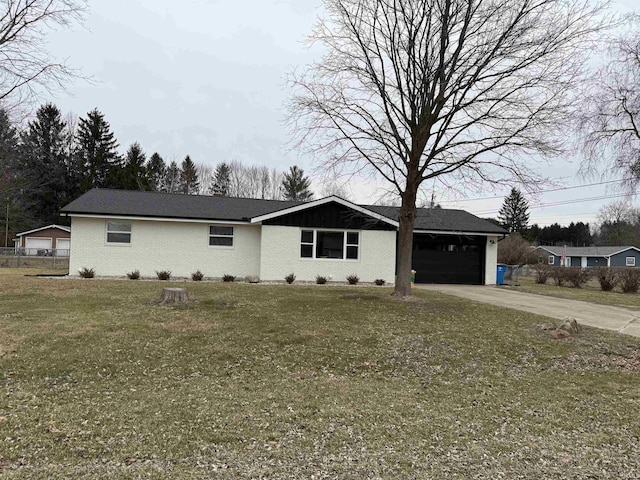 ranch-style house with a garage and a front lawn