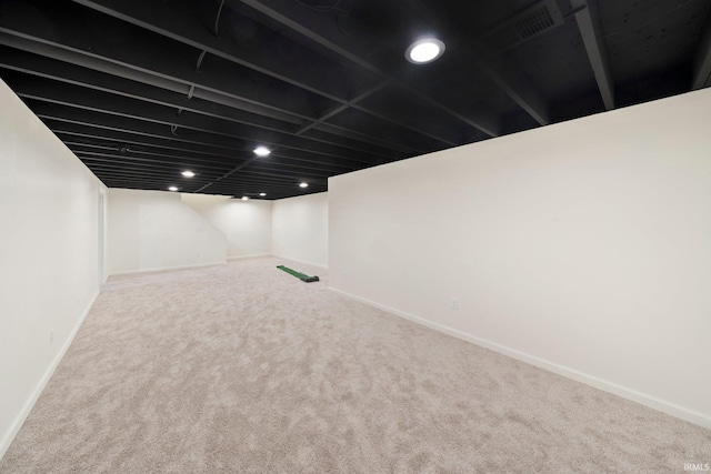 basement with carpet flooring