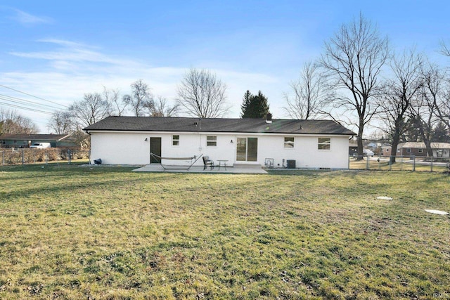 back of house featuring a patio, a yard, and central AC