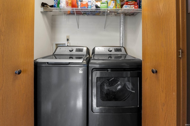 laundry room featuring washer and clothes dryer