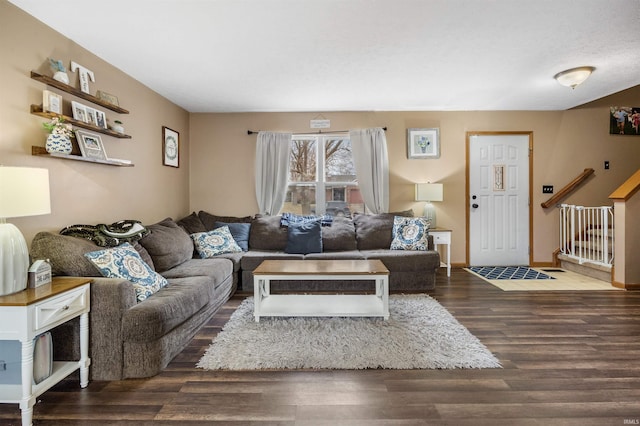 living room with dark hardwood / wood-style flooring