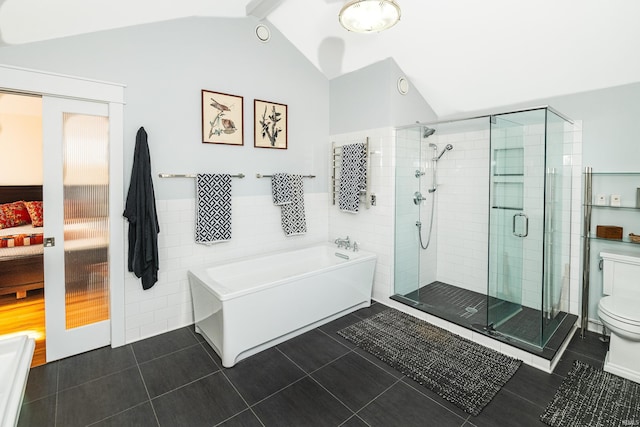 bathroom with plus walk in shower, lofted ceiling, tile walls, toilet, and tile patterned floors