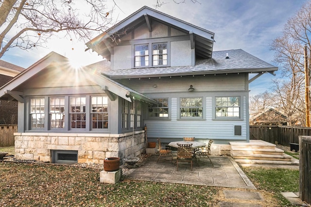 back of property featuring a patio