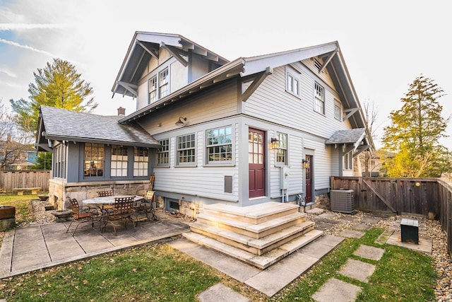 back of house featuring cooling unit and a patio area