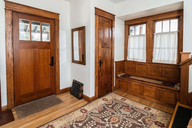 foyer entrance with plenty of natural light and light wood-type flooring