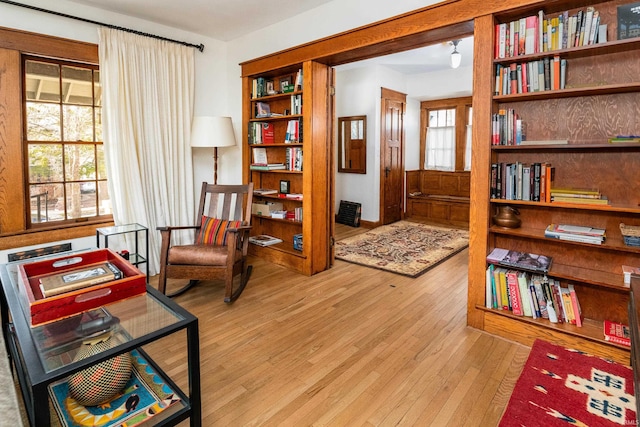 living area with light hardwood / wood-style flooring