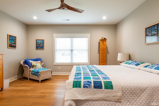 bedroom with ceiling fan and light wood-type flooring