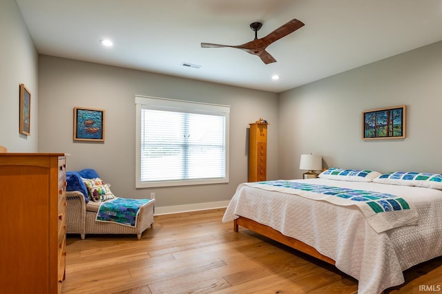 bedroom featuring ceiling fan and light hardwood / wood-style flooring