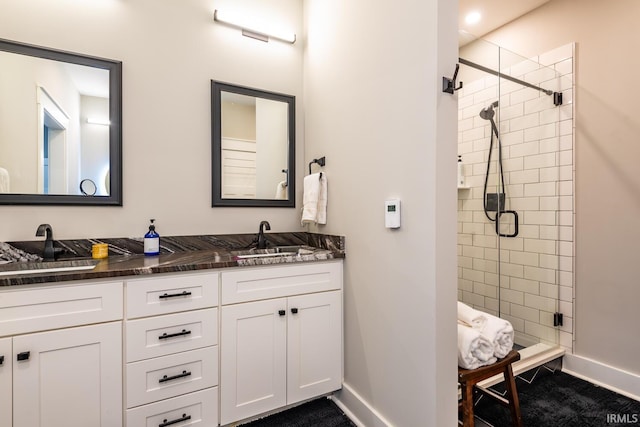 bathroom featuring vanity and an enclosed shower