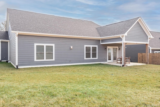 back of house featuring a patio and a lawn