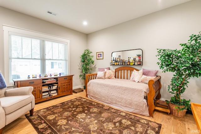 bedroom with light hardwood / wood-style floors