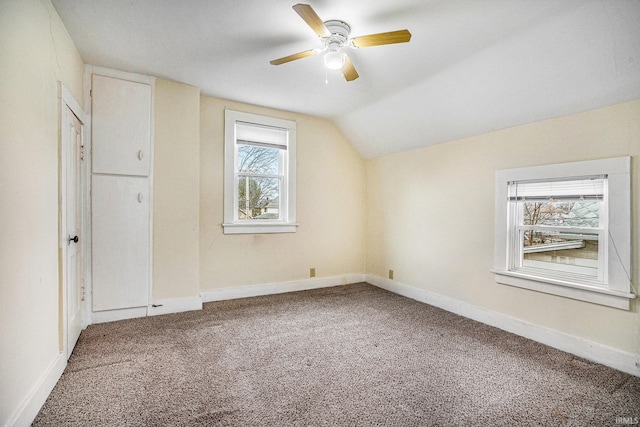 bonus room with vaulted ceiling, ceiling fan, and carpet floors