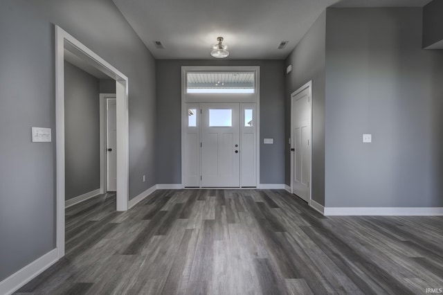 foyer with dark hardwood / wood-style flooring