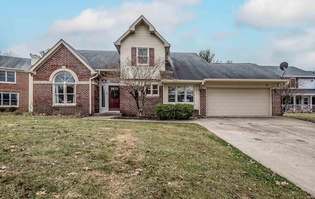 view of front property with a garage and a front yard