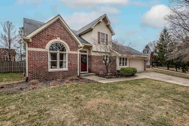 view of property featuring a garage and a front lawn