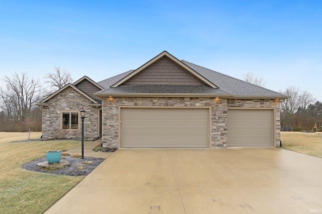 view of front of property with a garage and a front lawn