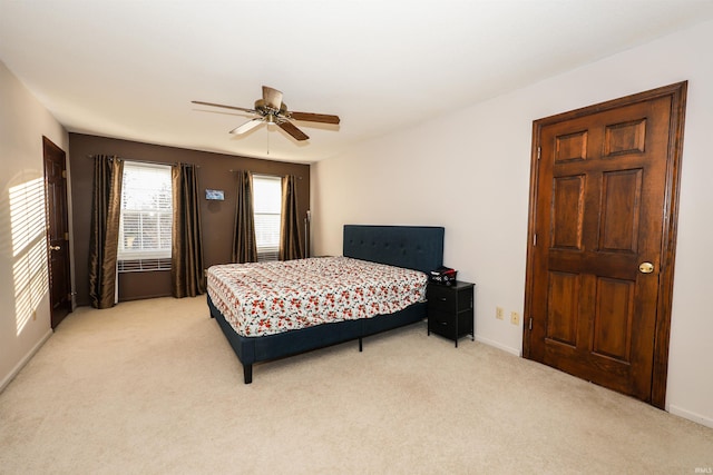 bedroom featuring ceiling fan and light colored carpet