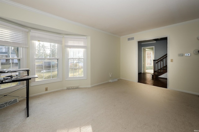 carpeted empty room featuring ornamental molding