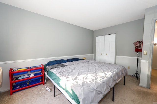 carpeted bedroom with a closet